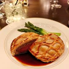 Butcher & Rose signature dishes Beef Wellington, Rose's Cheesecake with a pistachio crust and rose mousse